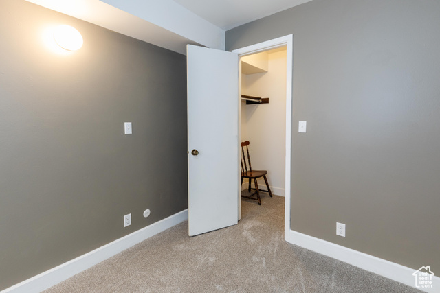167 East 100 North, Unit B Logan, UT 84321 - Photo 12 of 18 Unfurnished bedroom with light colored carpet and baseboards
