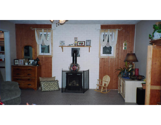 18 Fargo Street Springfield, MA 01109 - Photo 5 of 6 a living room with furniture a flat screen tv and gym equipment