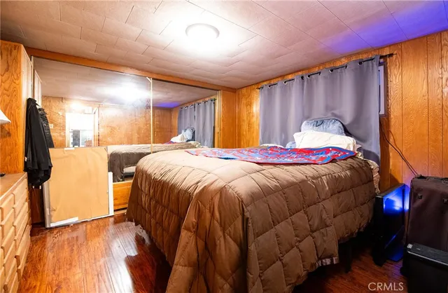 a spacious bedroom with a bed and a window