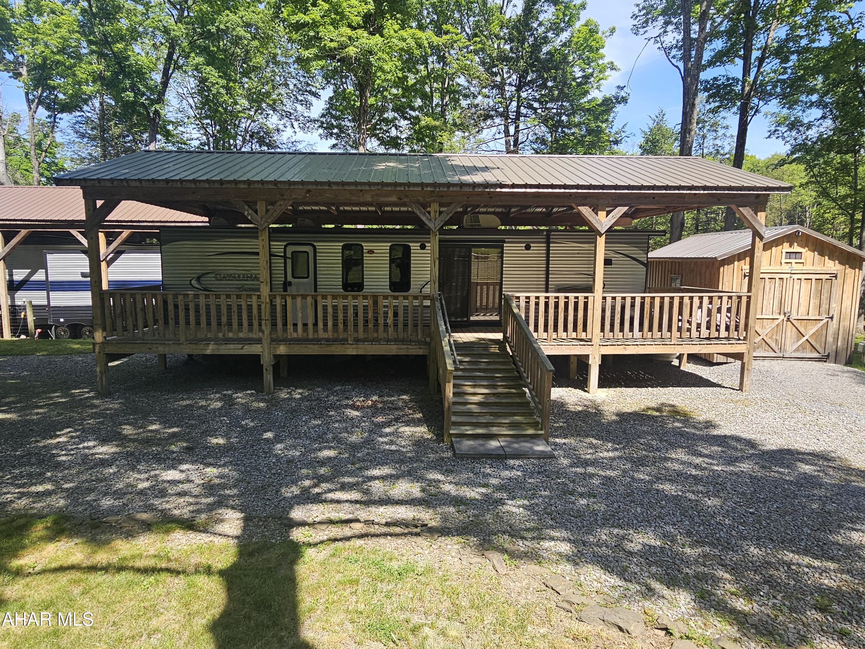 137 Mimosa Circle Flinton, PA 16640 - Photo 2 of 18 a view of a roof deck with a small yard