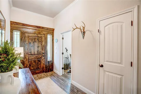 a view of a entryway with wooden floor