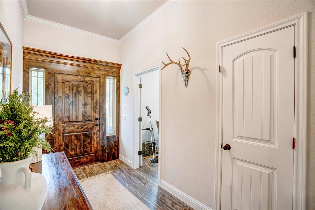 1355 Jay Bird Road Springtown, TX 76082 - Photo 11 of 40 a view of a entryway with wooden floor