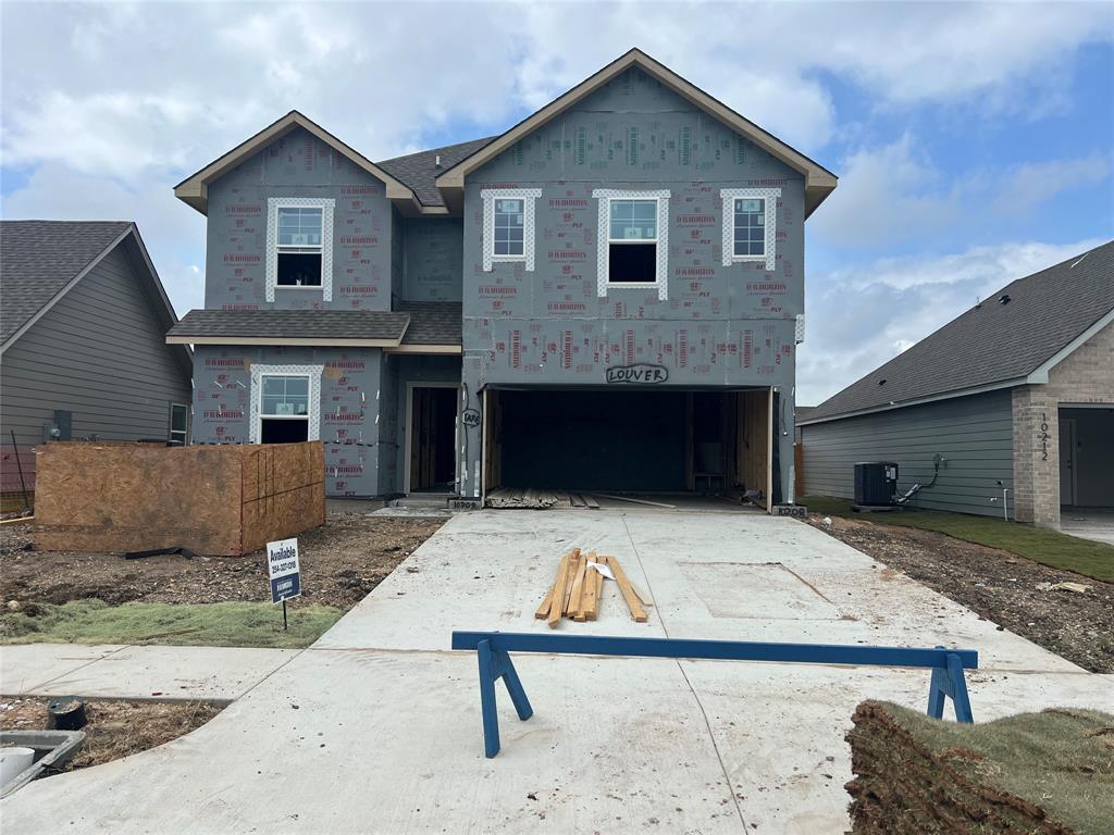 10208 Neptune Court Waco, TX 76708 - Photo 2 of 3 a front view of a house with garage