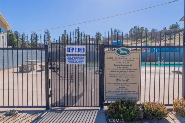 a view of a balcony with two chairs and a table