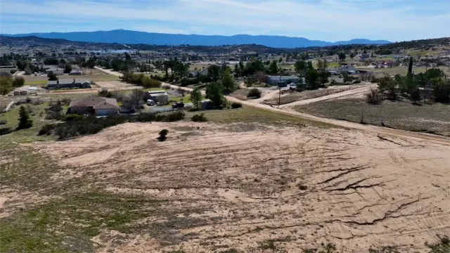 a view of a town with mountains in the background