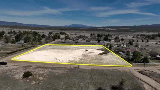 a view of a town with mountains in the background