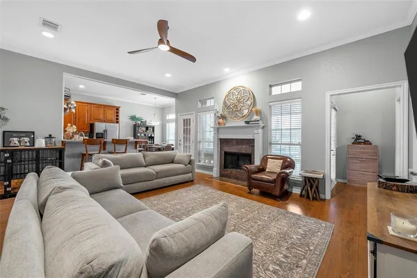 a dining hall with stainless steel appliances kitchen island granite countertop furniture and a view of kitchen