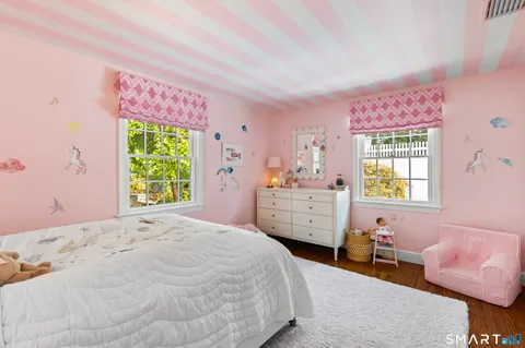 a bathroom with a sink a mirror and a window
