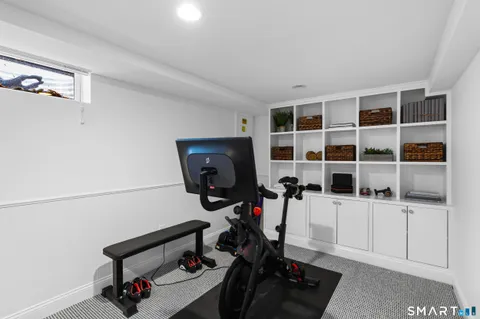 a bedroom with a bed and a night stand