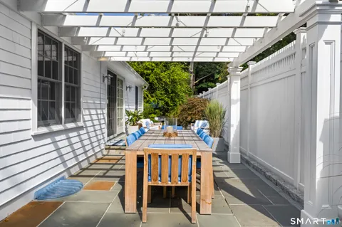 a view of a patio with couches and potted plants