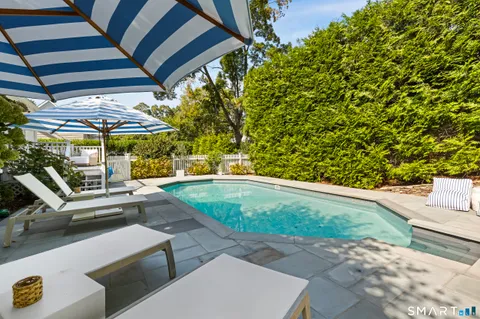 a view of a patio with swimming pool