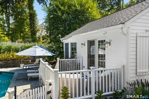 an aerial view of house with yard swimming pool and outdoor seating
