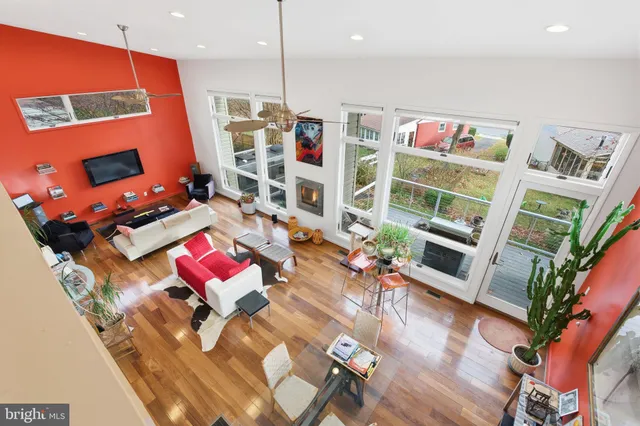 a living room with furniture a rug and a chandelier