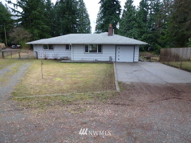 7115 Morgan Road Everett, WA 98203 - Photo 1 of 13 a house with swimming pool in front of it
