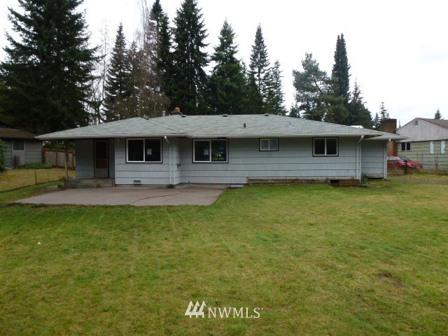 7115 Morgan Road Everett, WA 98203 - Photo 2 of 13 a front view of a house with garden
