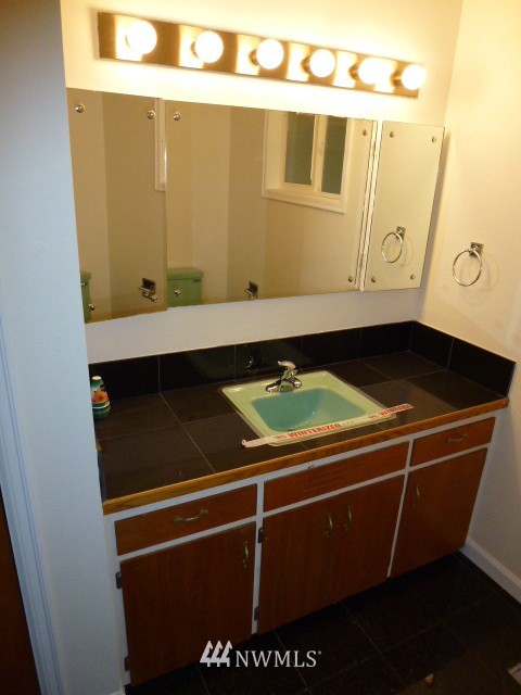 7115 Morgan Road Everett, WA 98203 - Photo 12 of 13 a room with storage and utility