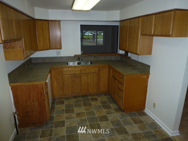 7115 Morgan Road Everett, WA 98203 - Photo 8 of 13 a bathroom with a sink and a mirror