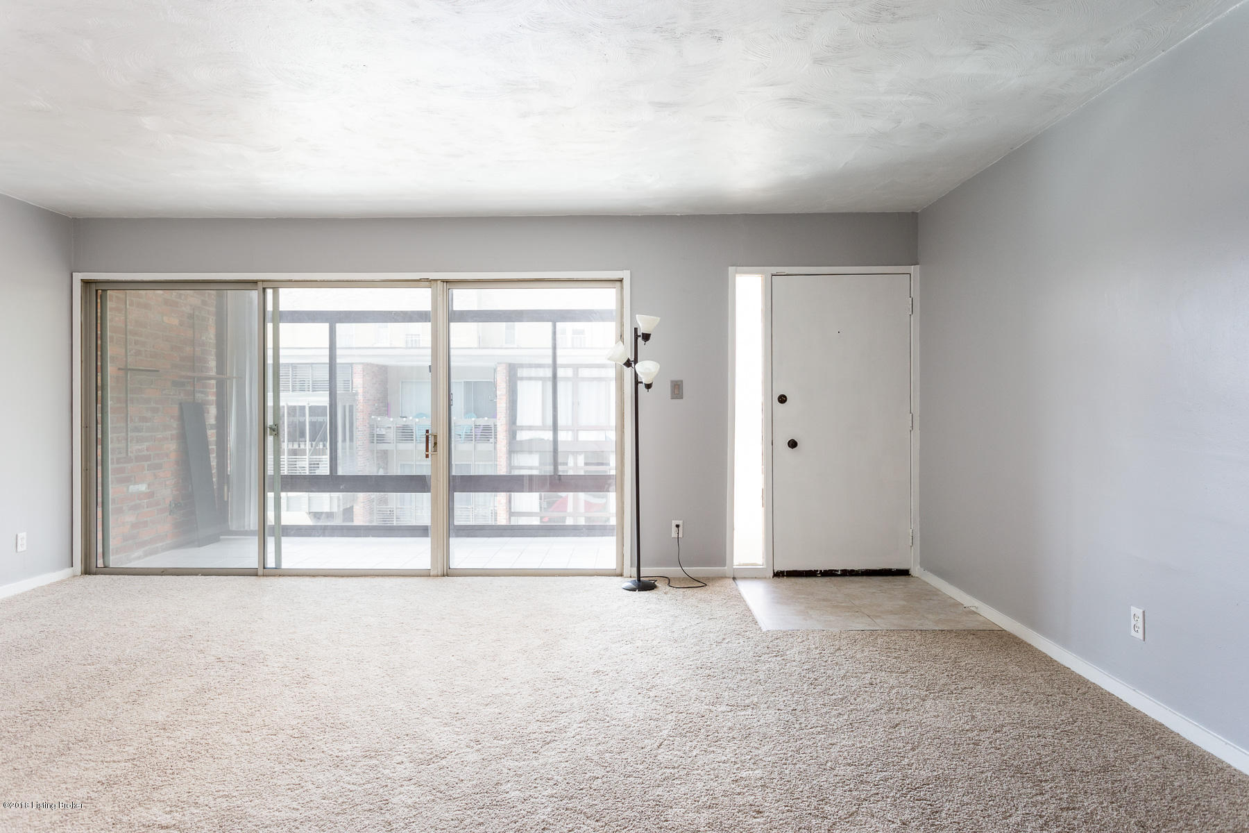 1040 Cherokee Road, Unit D5 Louisville, KY 40204 - Photo 7 of 20 Living Room with enclosed porch for extra space
