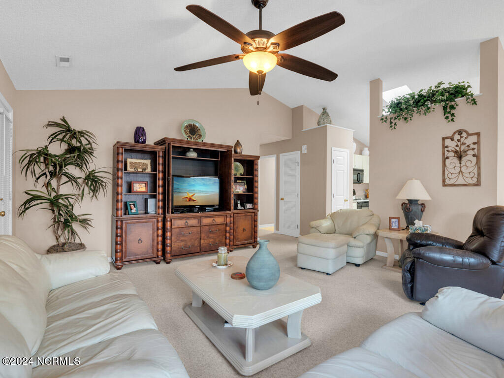417 Deer Path Calabash, NC 28467 - Photo 3 of 32 Enjoy the spacious living area. The living room is not just about square footage; it's about the freedom it provides, its versatility, and the atmosphere it cultivates.