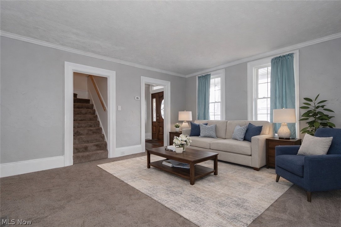 30200 Ridge Road Wickliffe, OH 44092 - Photo 9 of 43 Carpeted living room with stairs and crown molding