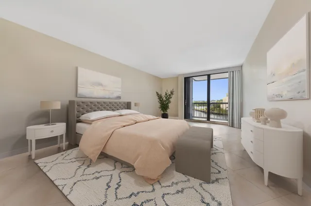 a bedroom with a large bed and a window