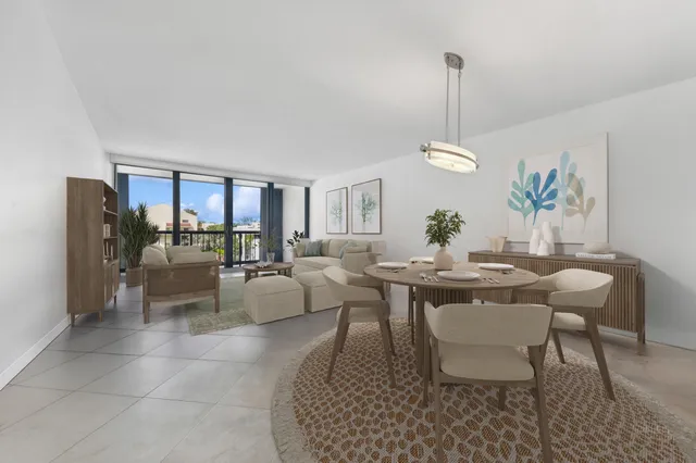 a living room with furniture a dining table and a dining table