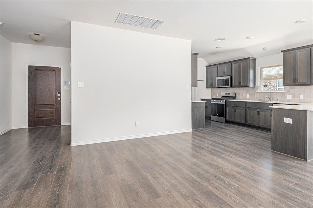 1500 Elizabeth Street Anna, TX 75409 - Photo 6 of 25 a view of kitchen with wooden floor