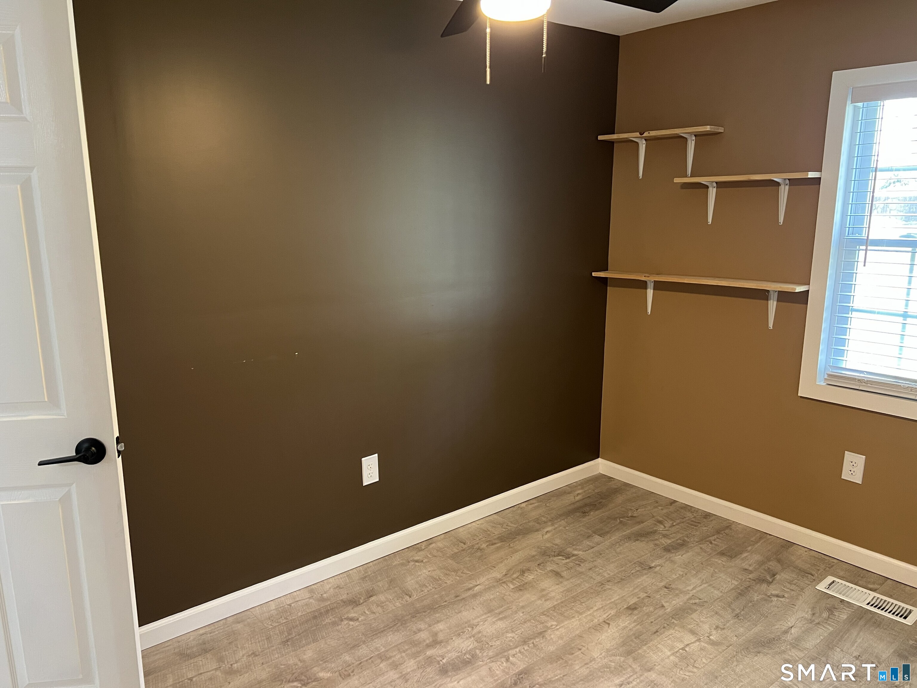 82 Bingham Street Bristol, CT 06010 - Photo 21 of 40 an empty room with windows