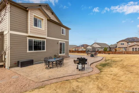 a view of house with outdoor space and seating area