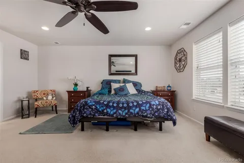a bedroom with bed and window