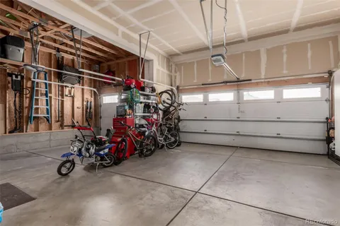 a view of a garage with rack and bicycle