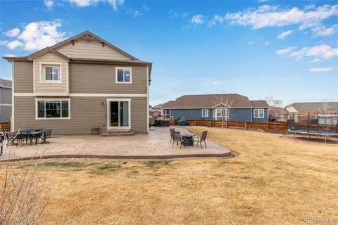a house view with swimming pool and porch