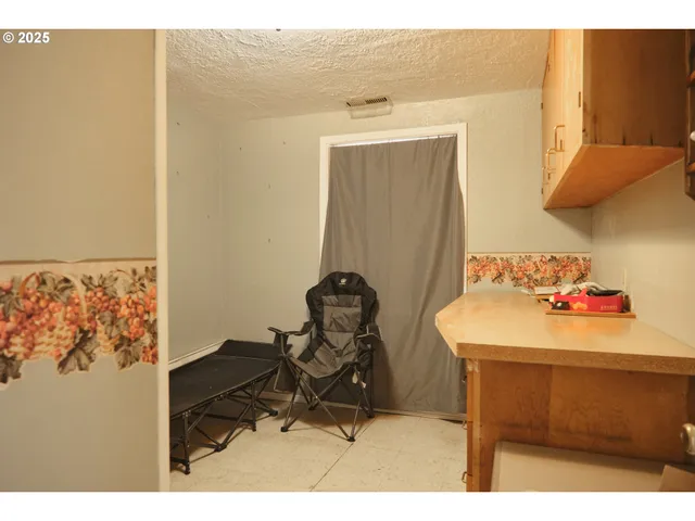 a room with furniture and gym equipment