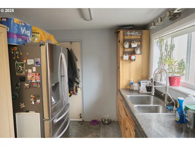 a bathroom with a sink a bathtub and a window
