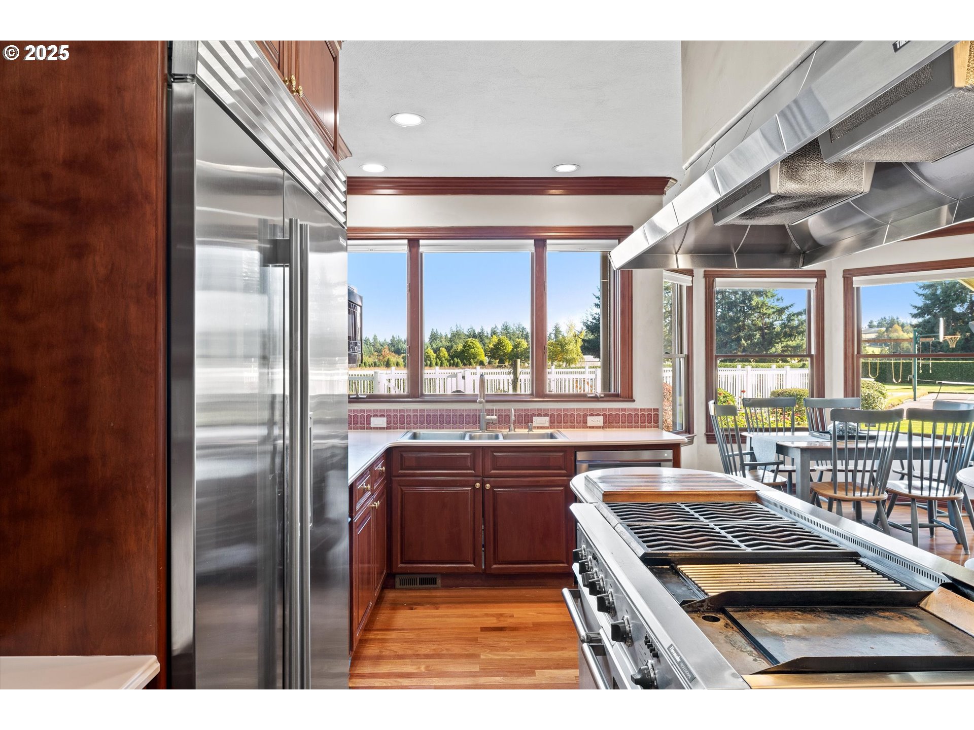 13680 Southwest Morgan Road Sherwood, OR 97140 - Photo 30 of 48 a kitchen with stainless steel appliances granite countertop a refrigerator and a sink