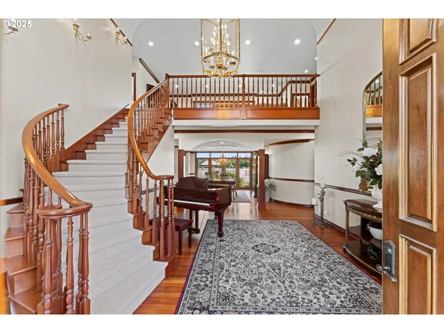 a view of entryway dining room and hall with wooden floor