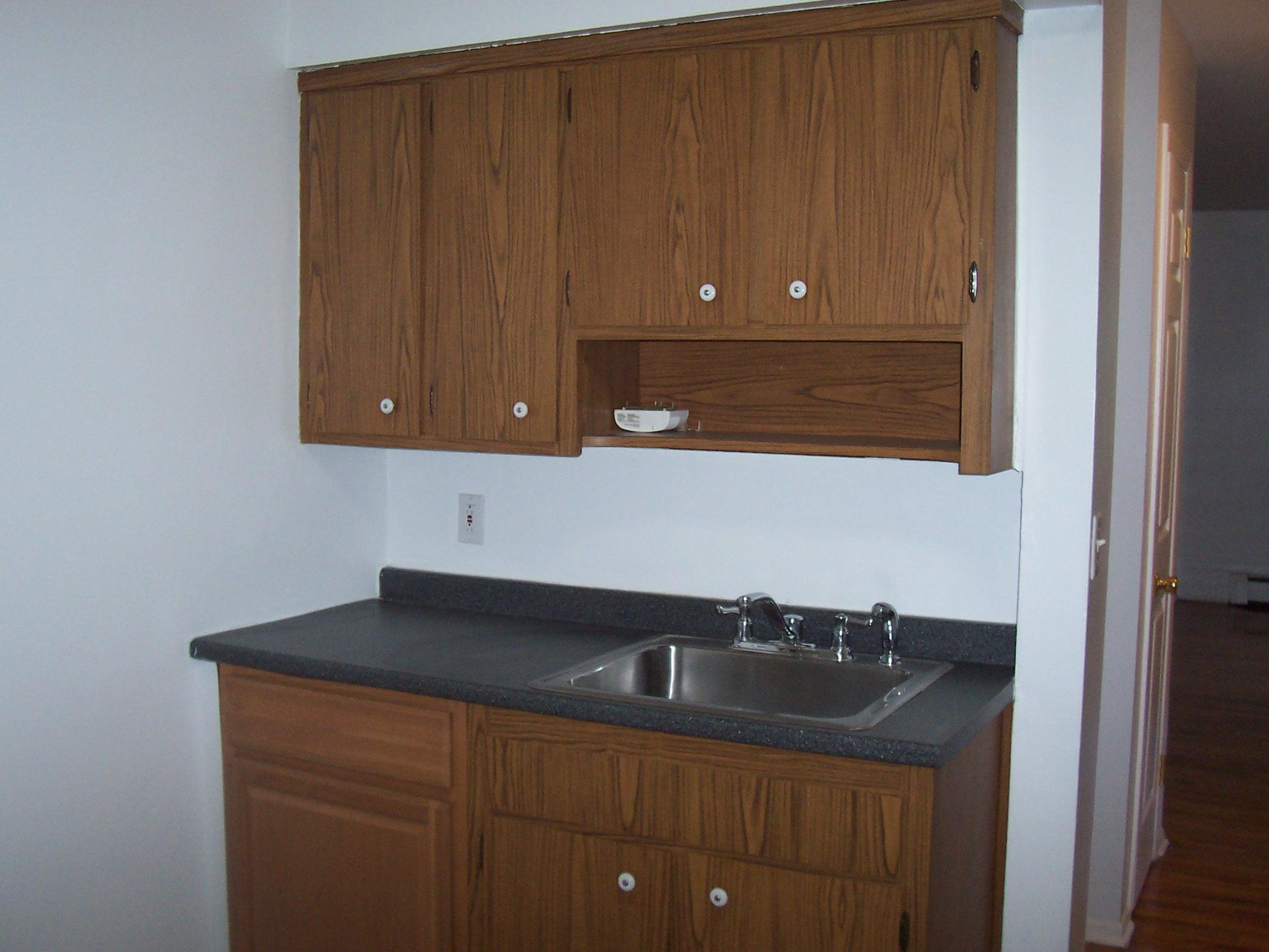 21 Pavilion Road, Unit 9 Suffern, NY 10901 - Photo 5 of 8 a kitchen with a sink and cabinets