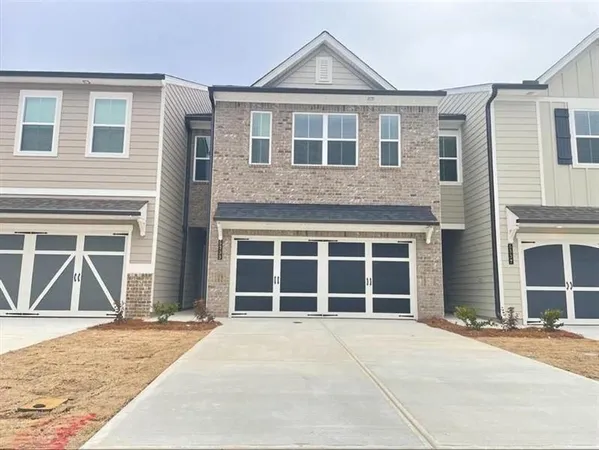 a front view of a house with a garage