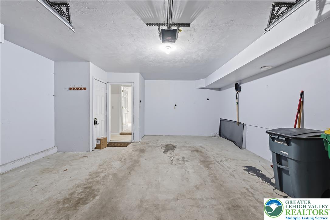 5607 Spring Ridge Drive West Macungie, PA 18062 - Photo 25 of 26 A spacious garage interior includes durable concrete flooring and direct entry to the home.