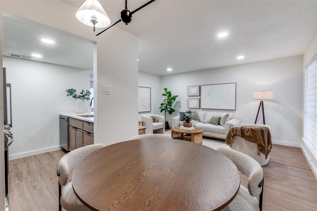 4525 Gilbert Avenue, Unit 202 Dallas, TX 75219 - Photo 9 of 13 a living room with furniture and a table
