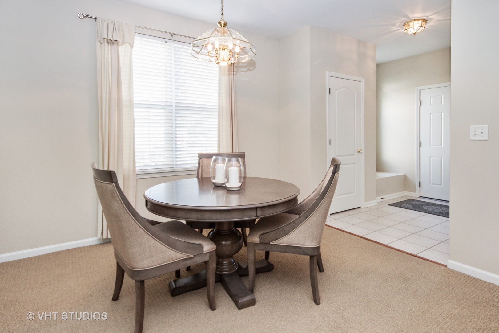 2460 Oneida Lane, Unit 2460 Naperville, IL 60563 - Photo 16 of 16 a dining room with furniture a chandelier and window