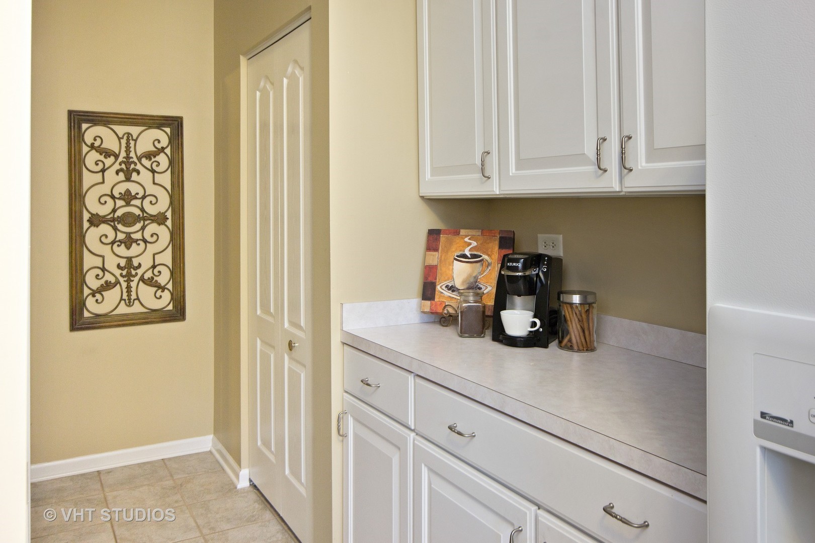 2460 Oneida Lane, Unit 2460 Naperville, IL 60563 - Photo 2 of 16 a kitchen with a white cabinets and a stove
