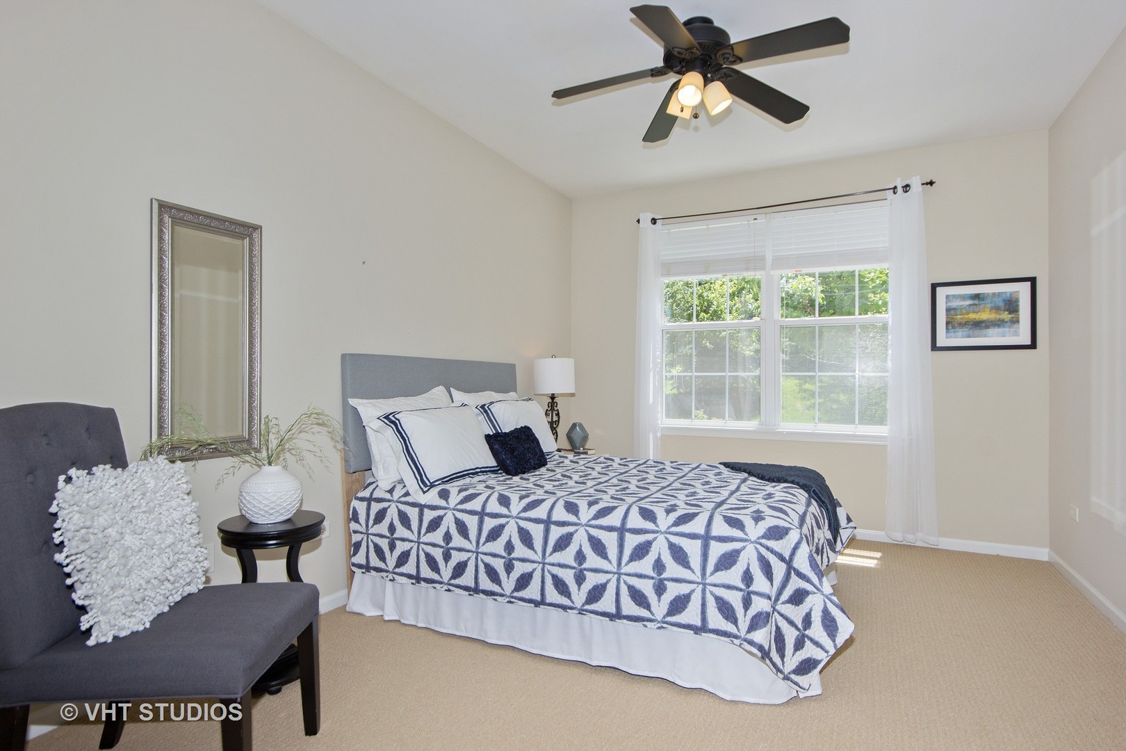 2460 Oneida Lane, Unit 2460 Naperville, IL 60563 - Photo 3 of 16 a bedroom with a bed couches chair and a large window