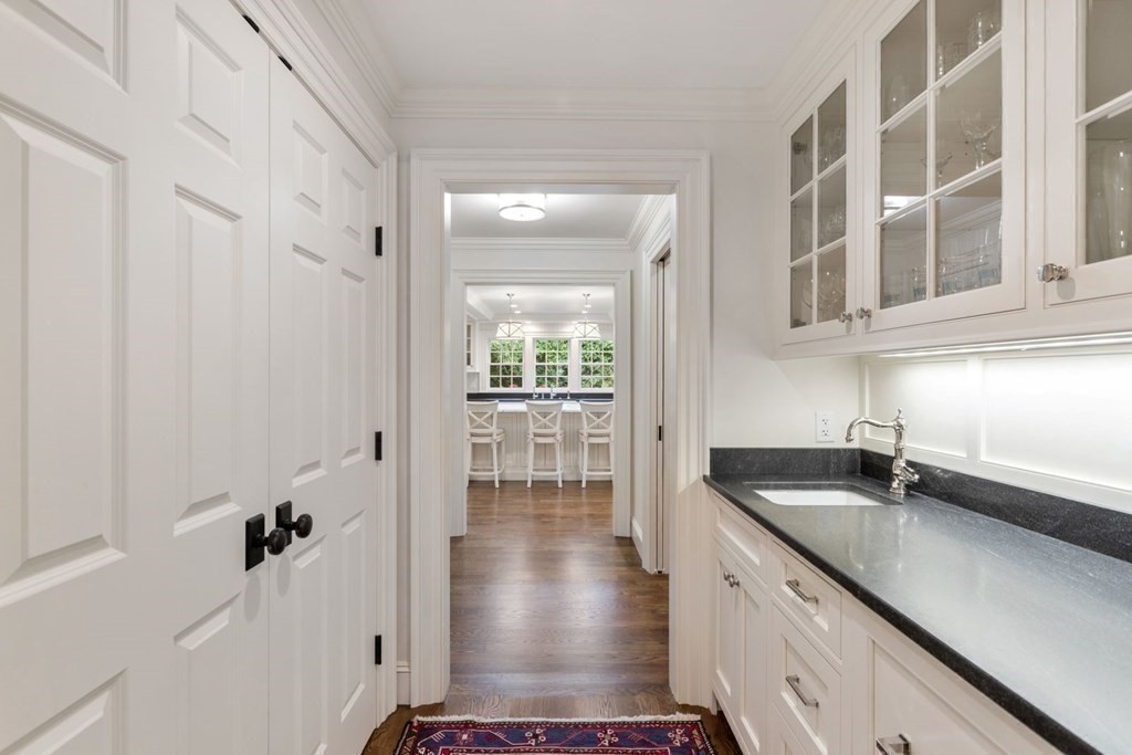 109 Edmunds Road Wellesley, MA 02481 - Photo 11 of 29 a kitchen with a sink and cabinets