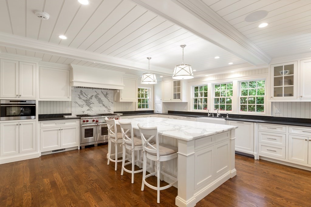 109 Edmunds Road Wellesley, MA 02481 - Photo 12 of 29 a kitchen with stainless steel appliances granite countertop a stove and a wooden floors