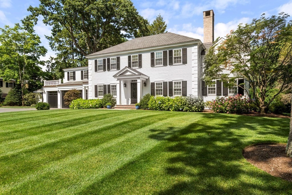 109 Edmunds Road Wellesley, MA 02481 - Photo 2 of 29 a front view of a house with a garden