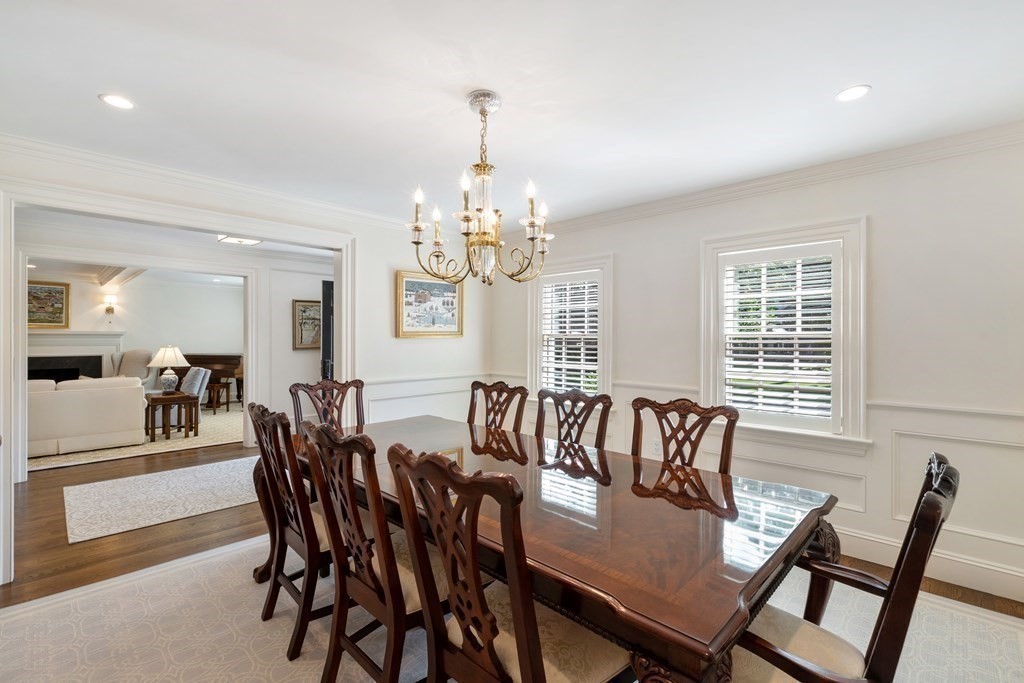 109 Edmunds Road Wellesley, MA 02481 - Photo 8 of 29 a view of a dining room with furniture a chandelier and wooden floor