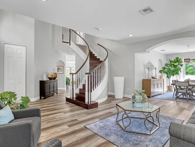 a view of a dining room with furniture window and wooden floor