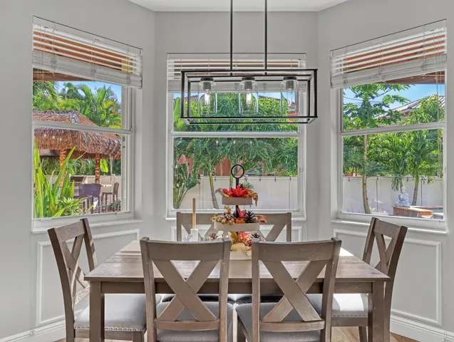 a bath tub sitting in a bathroom next to a window