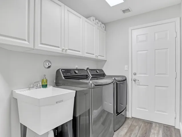 a bathroom with a granite countertop sink a toilet and a bathtub